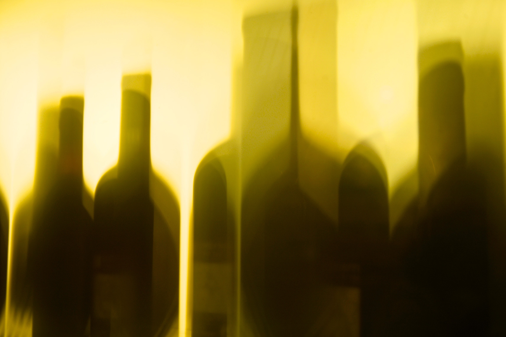 Wine Bottle cast tall shadows in Italy/Steve Mason Photography