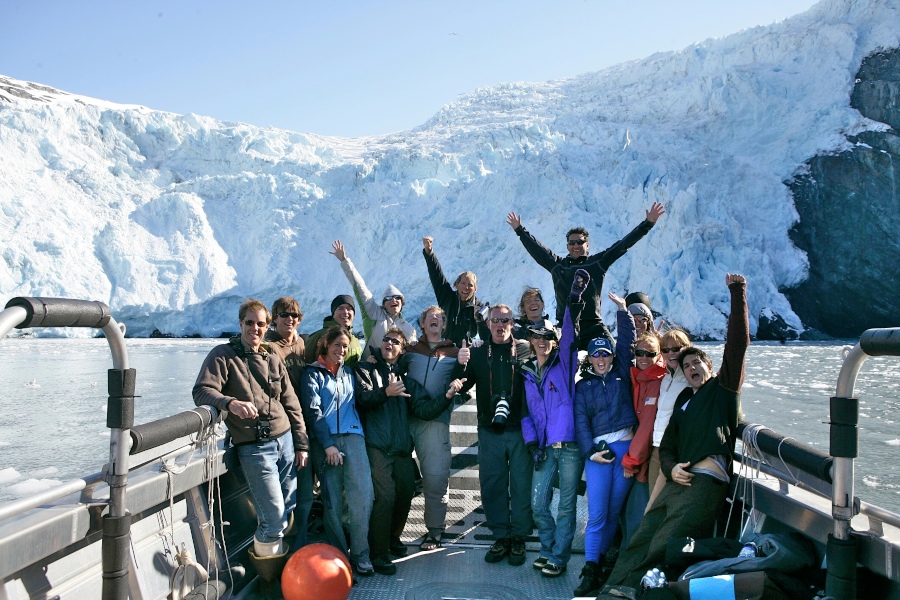 REI team poses in front of huge glacier.jpg