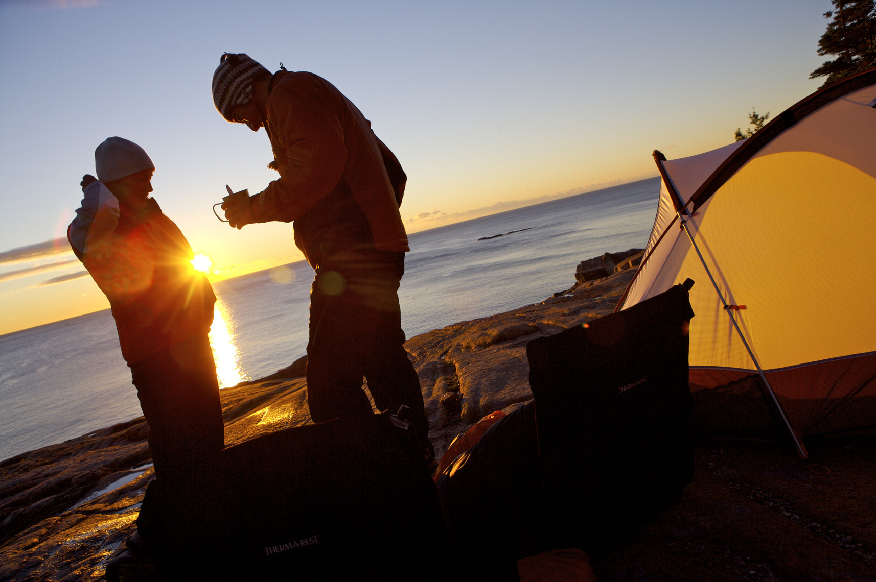 Campers enjoy sunrise in Arcadia Nationl Park, Maine