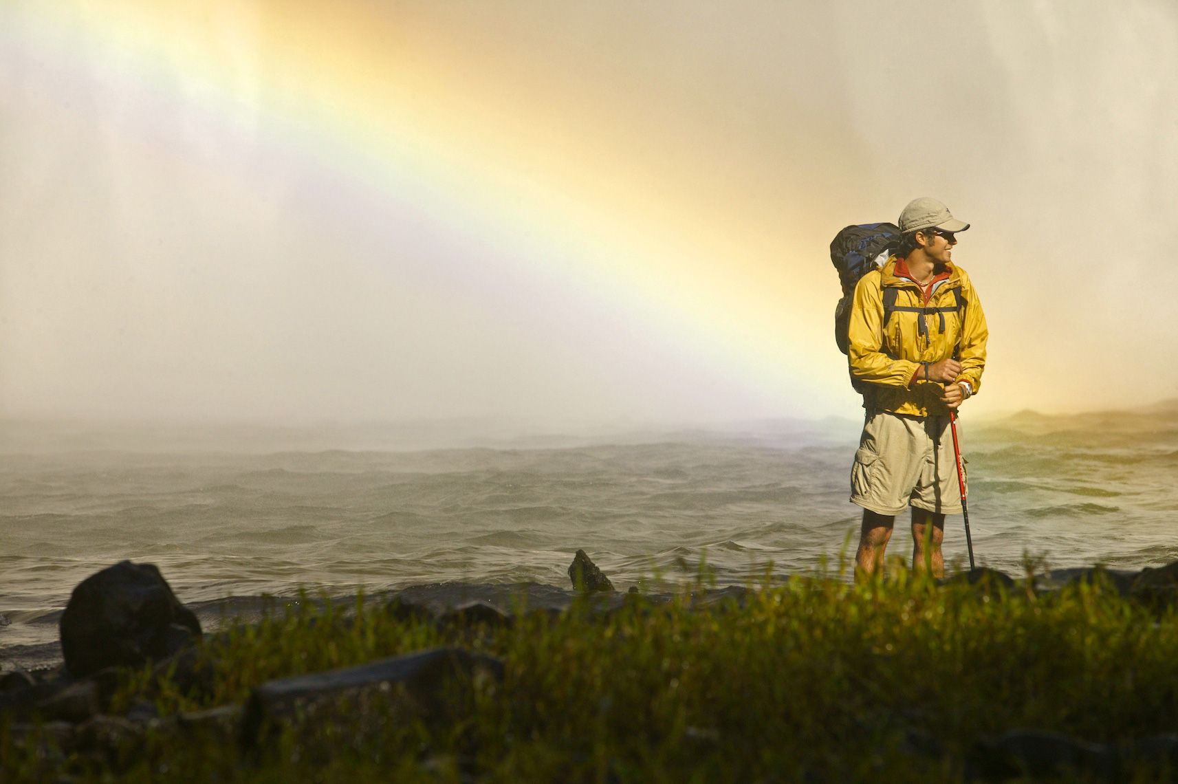 Rainbow over waterfall with Hiker in Hawaii/Steve Mason Photography