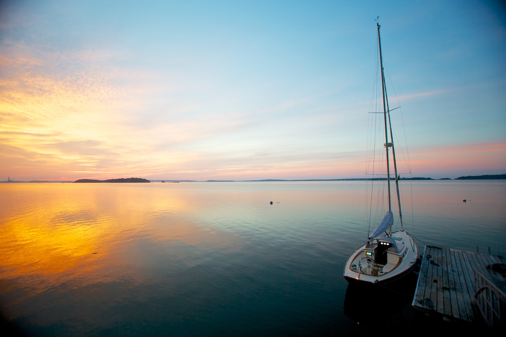 Sunrise with sailboat in MAine