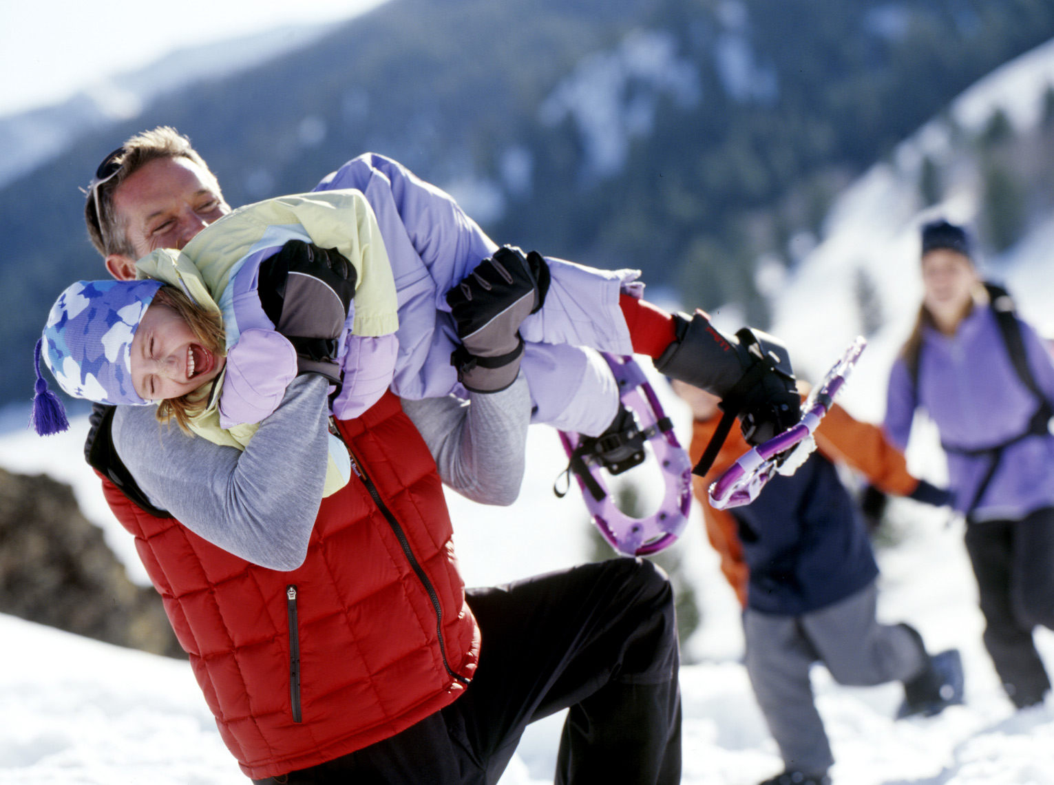 Family enjoying snowshoeing in mountains of Idaho/Steve Mason Photography